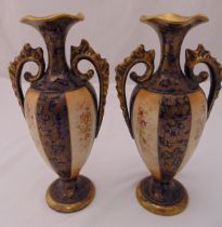 A pair of late 19th century Recherché vases oval form with gilded pierced scroll handles on raised