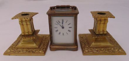 A pair of late 19th century brass candlesticks of hexagonal form on raised hexagonal bases, 49.