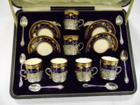 Minton cased coffee set to include cups, saucers and hallmarked silver cup holders