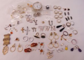A quantity of silver and costume jewellery to include rings, earrings, brooches and a pocket watch