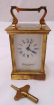 Charles Frodsham brass carriage clock with white enamel dial and Roman numerals to include key, 12cm