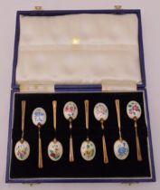 A cased set of hallmarked silver and enamel coffee spoons
