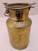 A brass milk can of tapering cylindrical form with pull off cover and applied cartouche to the side,