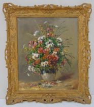 A framed oil on canvas still life of flowers in a vase, indistinctly signed bottom right, 61 x 50cm