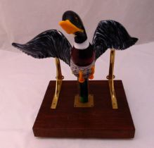 A Murano figurine of a Mallard in flight on rectangular wooden base with brass brackets, A/F, 44 x