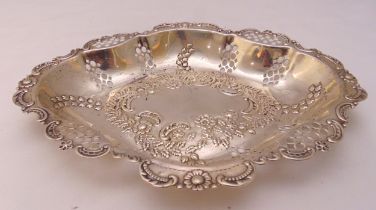 A hallmarked silver shaped oval fruit stand embossed with flowers and leaves, approx total weight