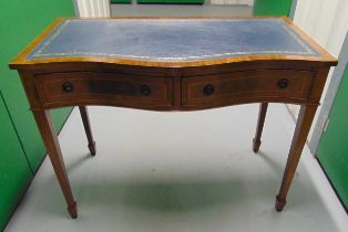 Mahogany serpentine fronted desk with tooled leather inset top with two drawers on four tapering