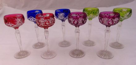 A set of eight polychromatic liquor glasses on star cut bases