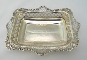 A Victorian hallmarked silver presentation pierced bonbon dish, rounded rectangular, London 1900