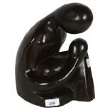 A contemporary hardwood sculpture depicting a mother and child, H28cm