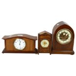 A small carved and painted mantel clock, 16.5cm, an arch-top clock and a small French mantel clock