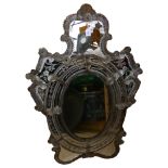 A Venetian wall mirror with elaborate moulded flowerhead mounts and etched panels, overall height