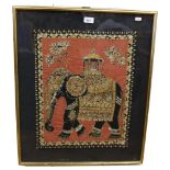 A framed Eastern embroidered fabric panel, with gilded decoration depicting a caparisoned