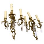A pair of gilded brass 3-branch wall sconces with glass lustre drops, drop 36cm