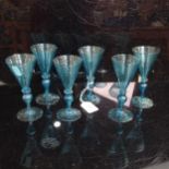 A set of 6 Wrythen blue glass goblets, H 13cm. 1 A/F