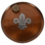 A copper salver with fleur de lis decoration, diameter 28cm, and a Royal Engineers' Military coat of