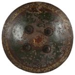 A 19th century Indian Dhal shield of convex form, with painted decoration and studded with 4 large