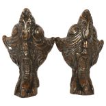 A pair of large patinated cast-iron furniture feet, with claw and foliate design, 41cm