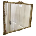 A wall mirror in Antique gilt scrolled frame, 39cm x 47cm