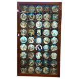 A late 20th century lightbox, the leadlight glass panel depicting 45 religious scenes, the central