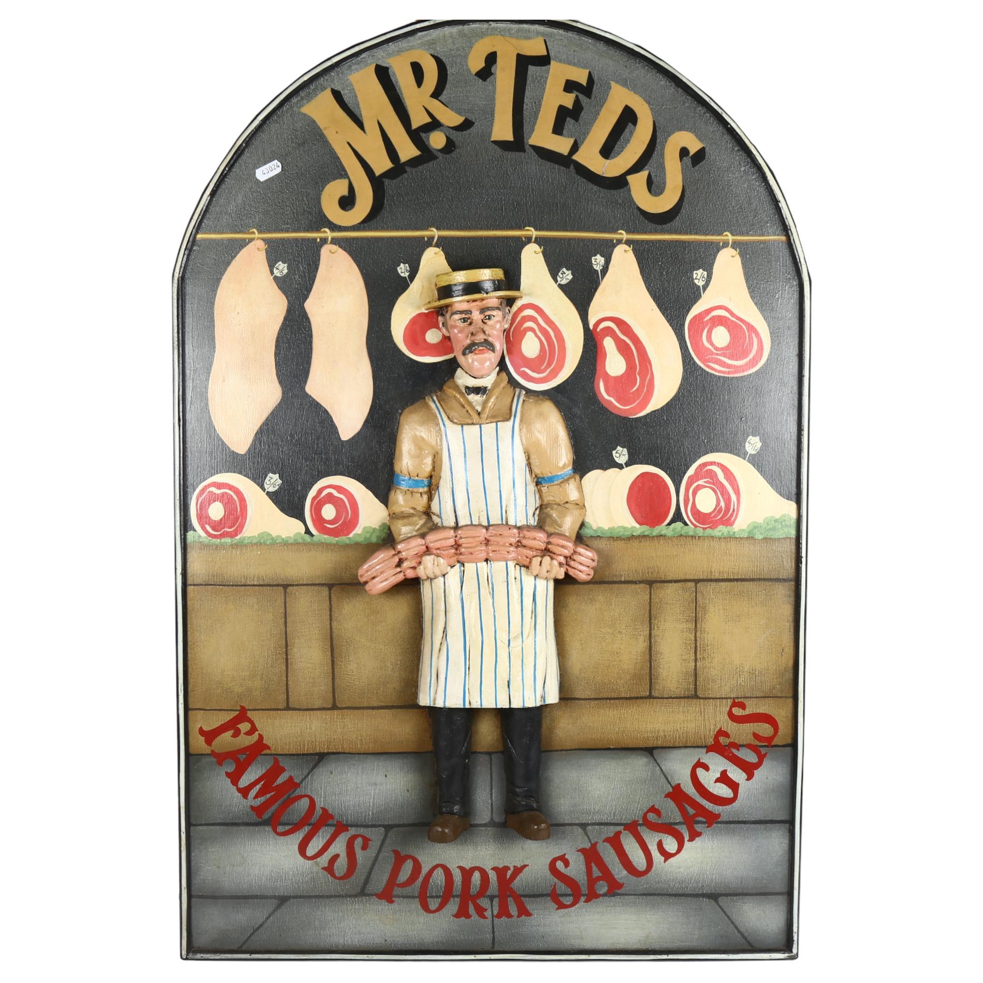 A large carved and painted wood butcher's advertising sign "Mr Ted's Famous Pork Sausages", 92 x