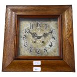 A square oak-cased 2-train wall clock, with engraved dial, 37cm