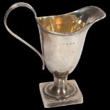 An Edward VII silver helmet-shaped cream jug, hallmarks for Birmingham 1906, 2.2oz