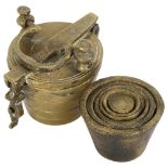 A set of 6 cast-brass resting weights, in cast-brass bucket container