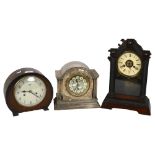 A Vintage mantel clock in silver plated case with pillar supports, H22cm, a Gothic clock, and a