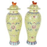 A pair of Chinese famille jaune baluster vases and covers, floral enamel decoration, H32cm