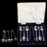 A cased set of 6 silver teaspoons with matching tongs, by Walker & Hall, and a set of 6 unmarked