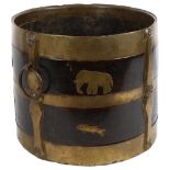 A 19th century Indian wood and brass-bound bucket with ring handles, stylised strapwork and animal