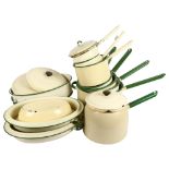 A collection of Vintage cream and green enamelled cookware, including 7 various saucepans, 3