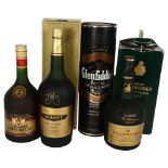 A bottle of Glenfiddich Special Reserve Scotch Whiskey, a Napoleon Grand Emperor Fine French Brandy,