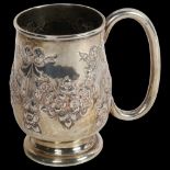 An Edward VII silver christening mug, with ribbon and bow embossed decoration and monogram, 2.6oz,