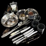 A group of silver items, to include napkin rings, small circular dish, silver-handled knives etc,