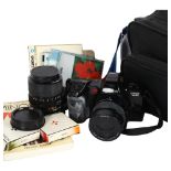 A Minolta Dynax 7000I camera, with a Minolta 35-80mm zoom lens, plus a Minolta zoom 35-70mm lens,