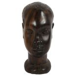 A large African Tribal carved hardwood head, H30cm