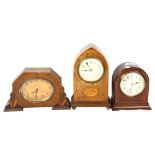 An Edwardian inlaid arch-top mantel clock, 23cm, a clock by Payne, Bromley, and an oak-cased 8-day