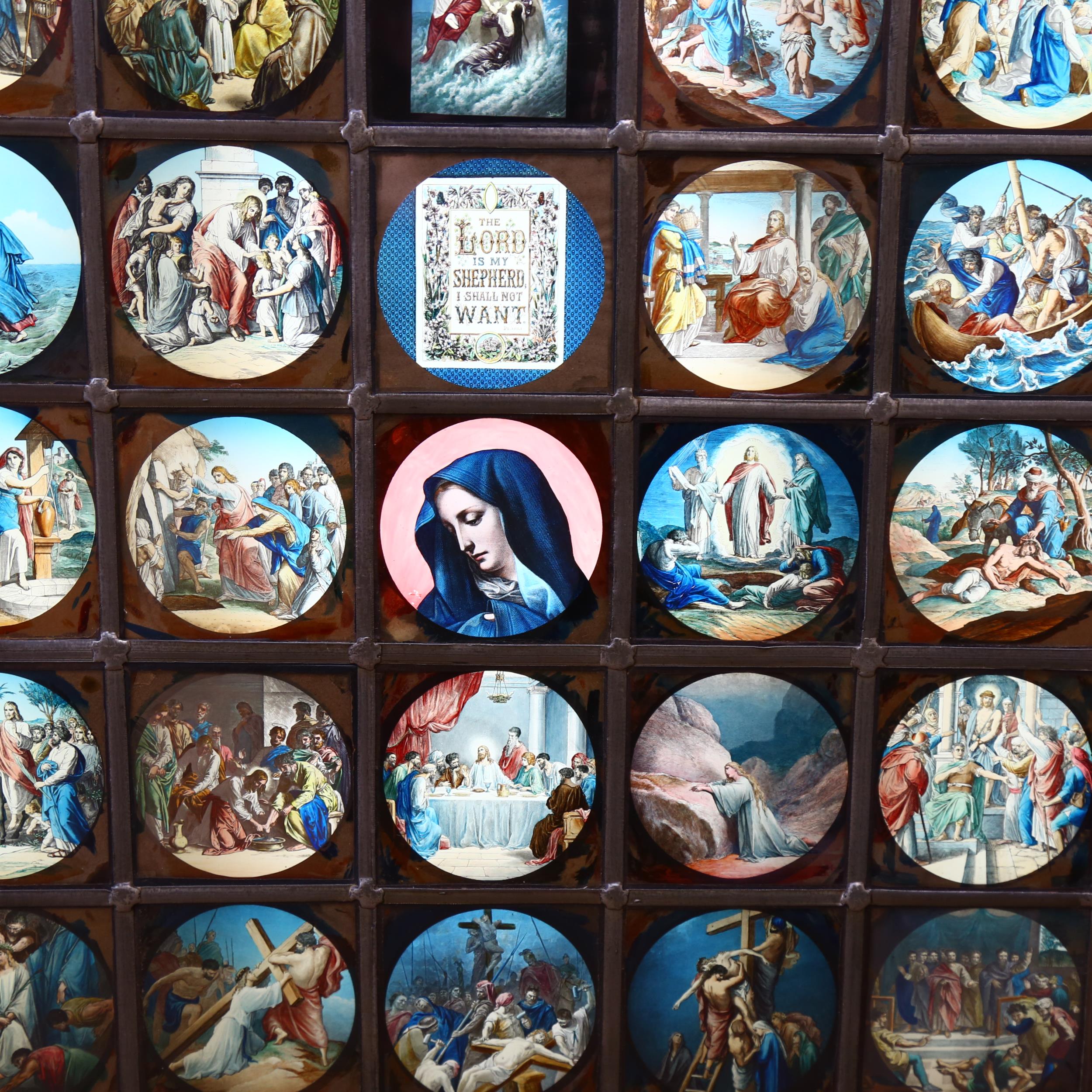 A late 20th century lightbox, the leadlight glass panel depicting 45 religious scenes, the central - Image 2 of 2