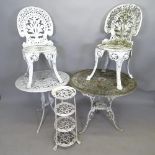 A painted cast metal circular garden table, 80cm x 69cm, another, 69cm x 65cm, two matching chairs