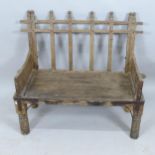 A rustic oak bench, raised on turned legs with lattice back. 98x90x44cm