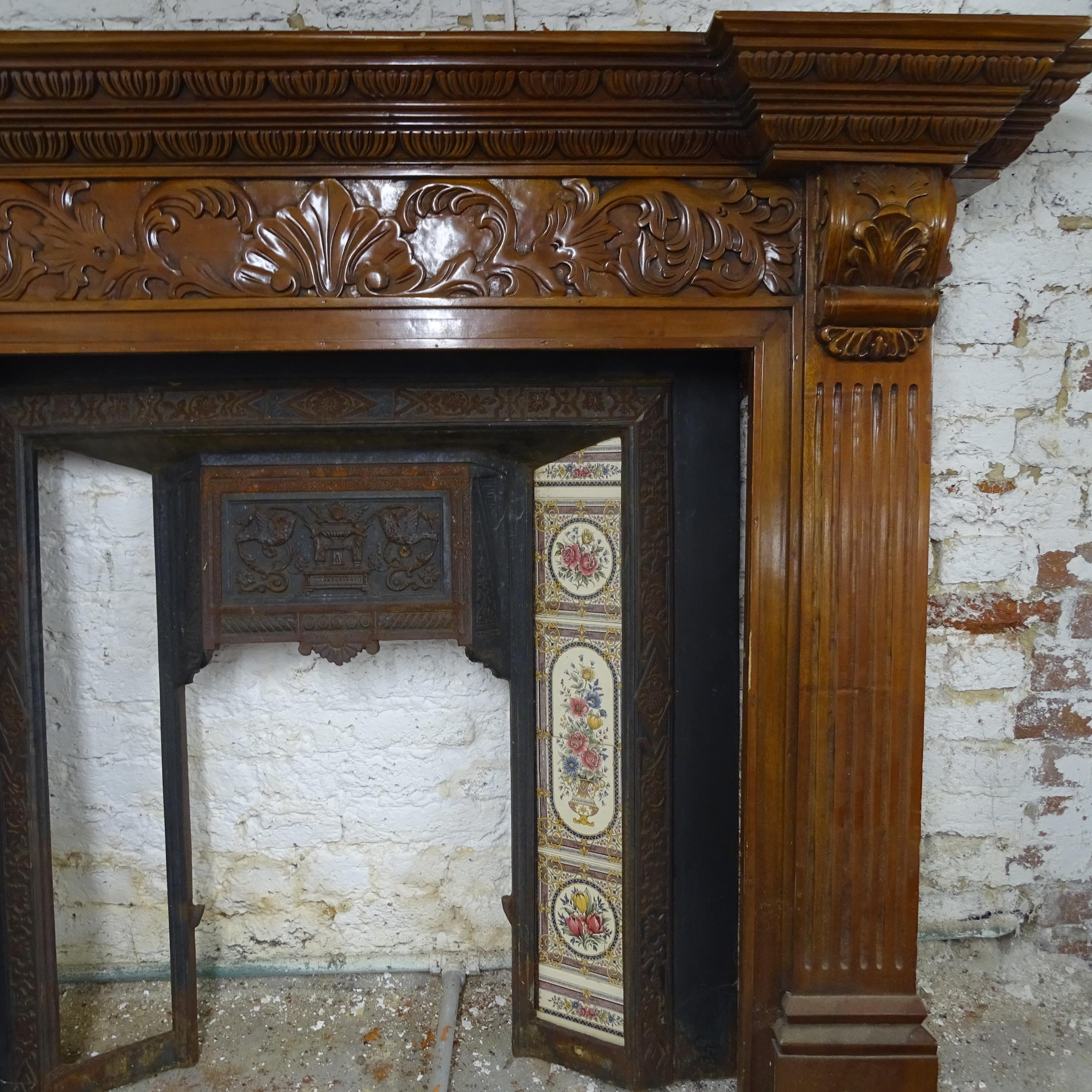A Victorian fireplace comprising a cast iron fire surround (98x99cm), a carved mahogany - Image 2 of 2