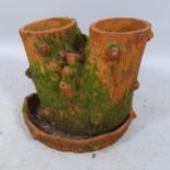 A weathered terracotta planter. Height 31cm.