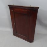 A Georgian oak spice cupboard with single panelled door. 77x94x11cm.