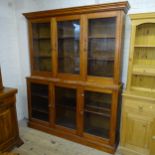 An antique stained pine two section bookcase with six glazed doors. 170x214x45cm