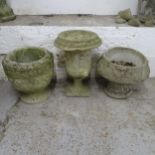 Three various weathered concrete garden urns. Tallest 36x54cm