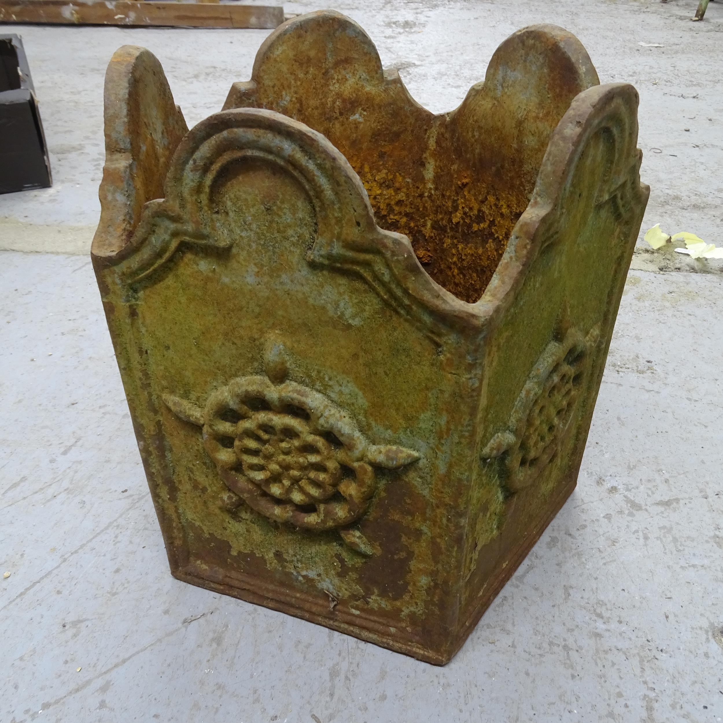 An antique cast iron pentagonal garden planter with rose decoration. 30x33cm