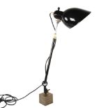 A mid-century adjustable desk lamp in the manner of Christian Dell for Kaiser Idell, on added bronze