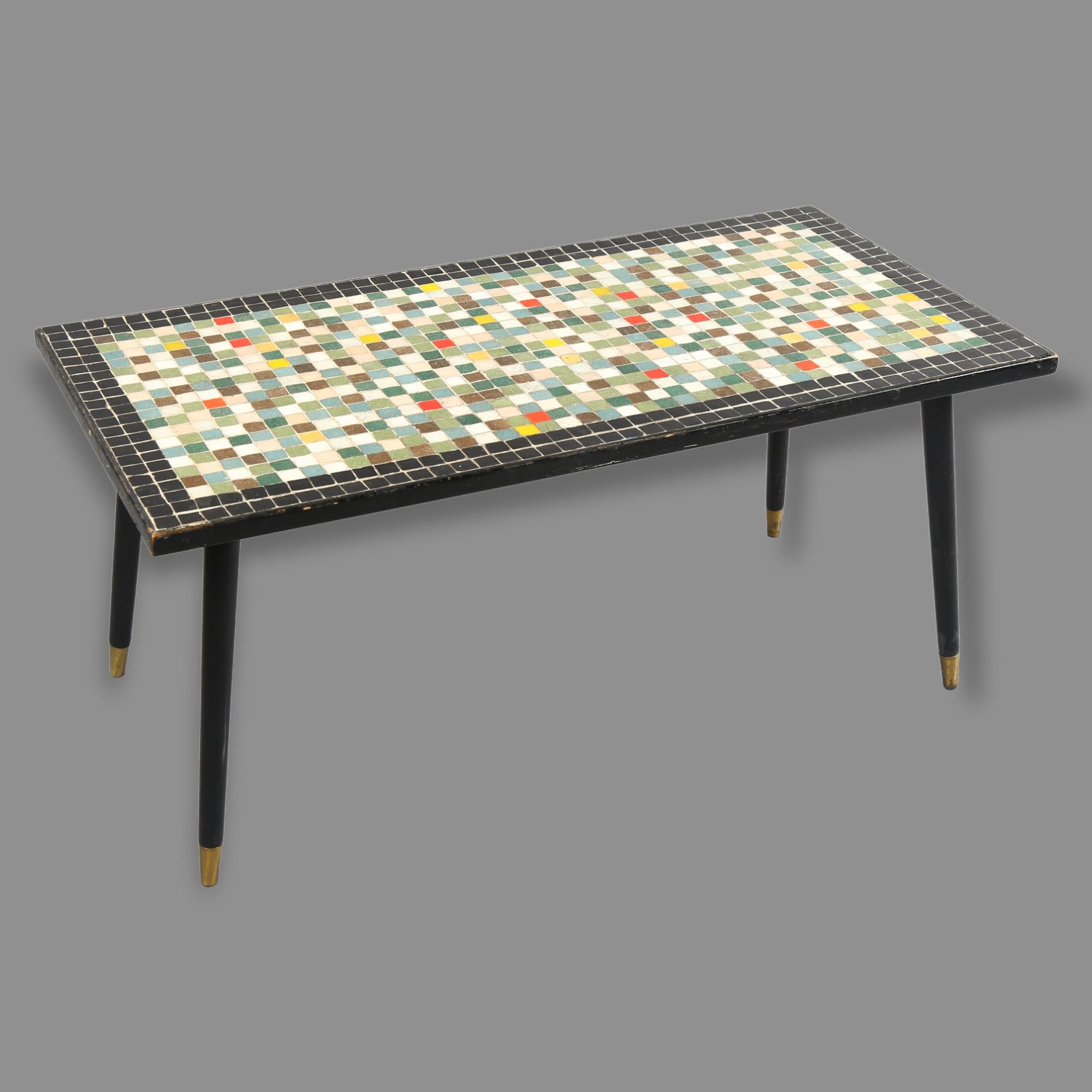 A 1950s' mosaic tile top coffee table, with ebonised surround and legs, 93 x 47cm, height 42cm